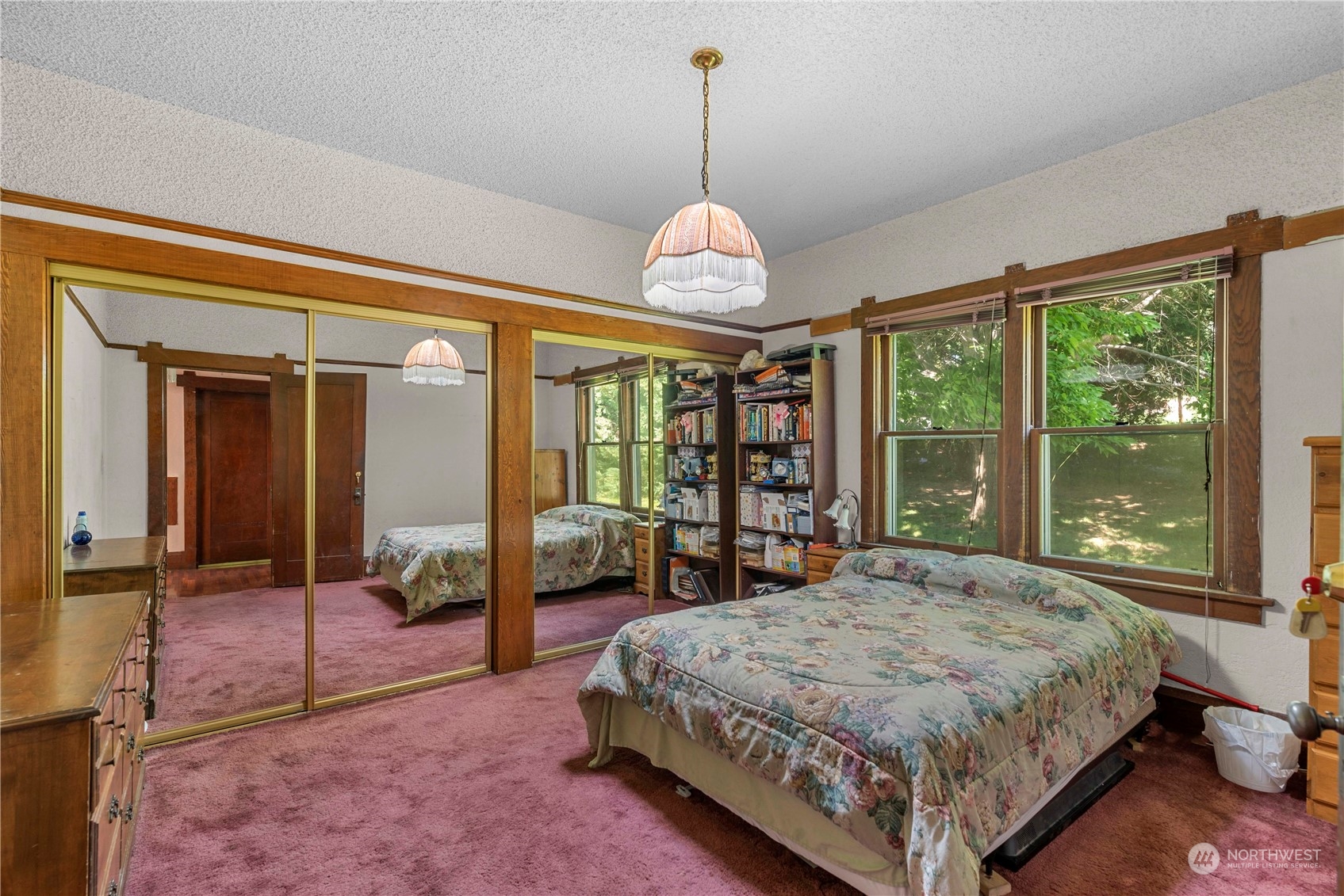 3327 Crestview Road Wenatchee, WA 98801 - Photo 12 of 39 a spacious bedroom with a large bed and a chandelier