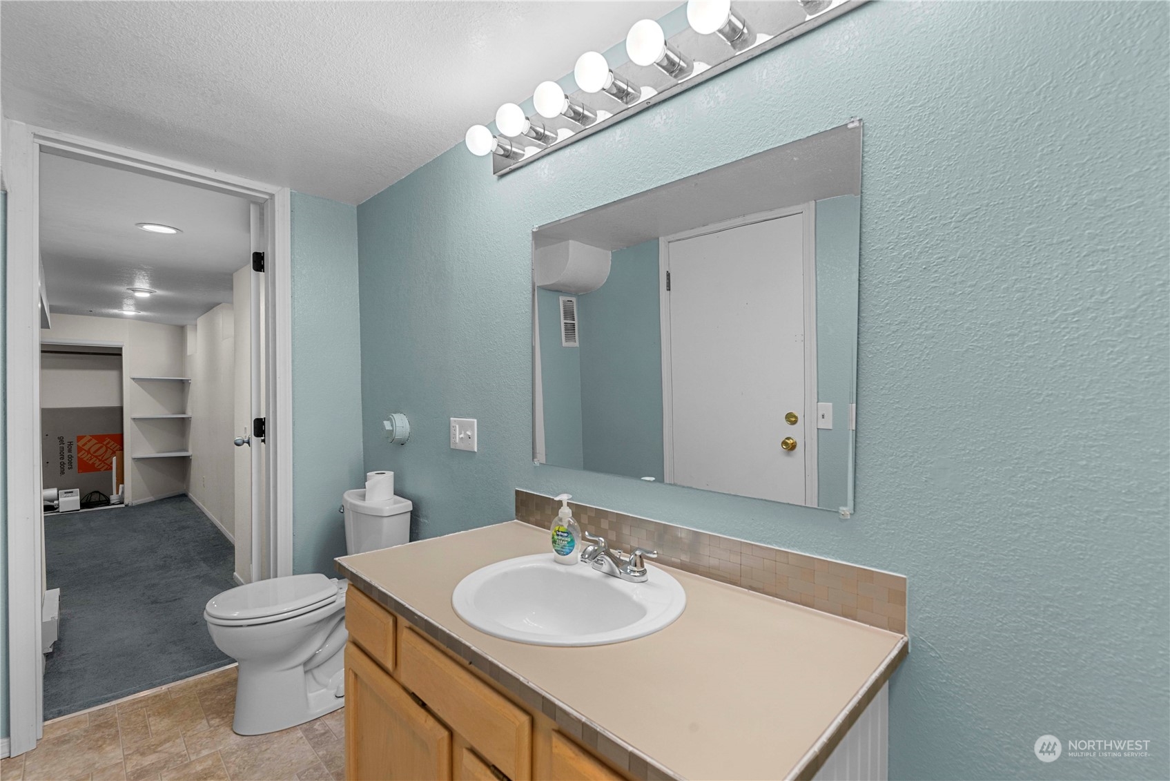 3327 Crestview Road Wenatchee, WA 98801 - Photo 26 of 39 a bathroom with a granite countertop sink a toilet and a mirror