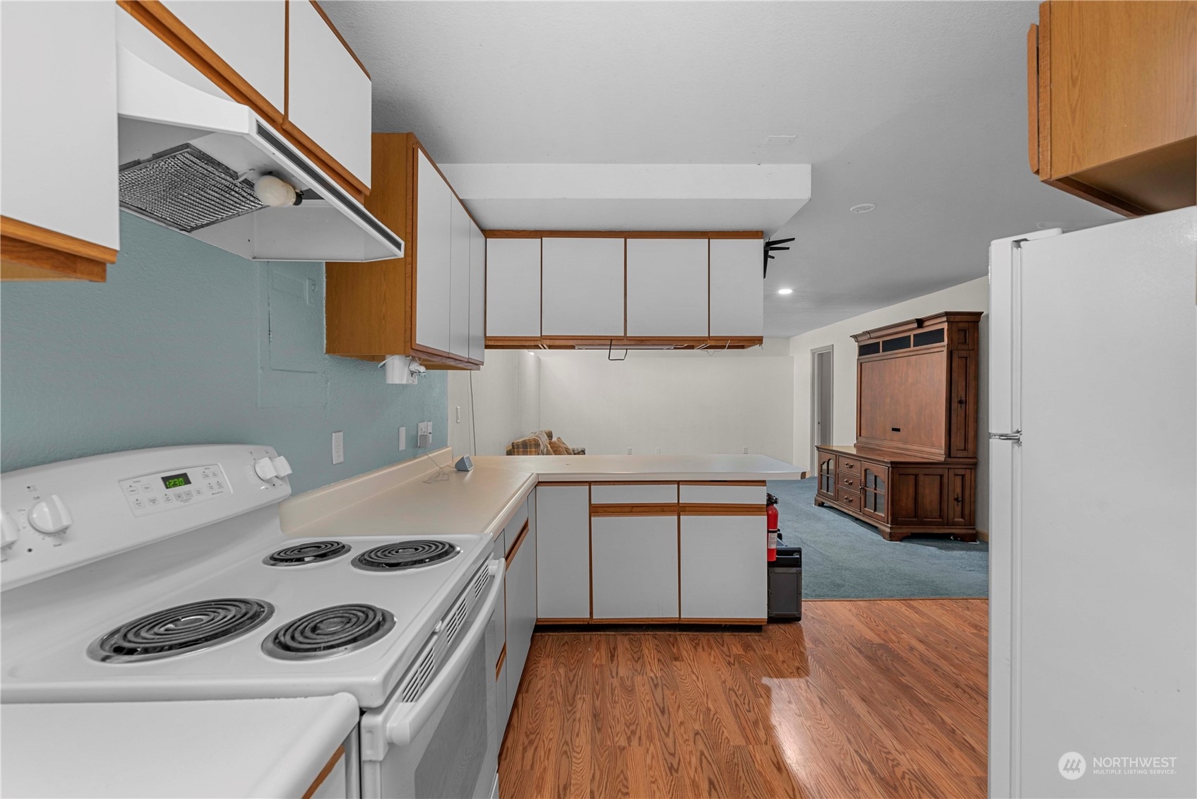 3327 Crestview Road Wenatchee, WA 98801 - Photo 29 of 39 a kitchen with a sink a stove and cabinets