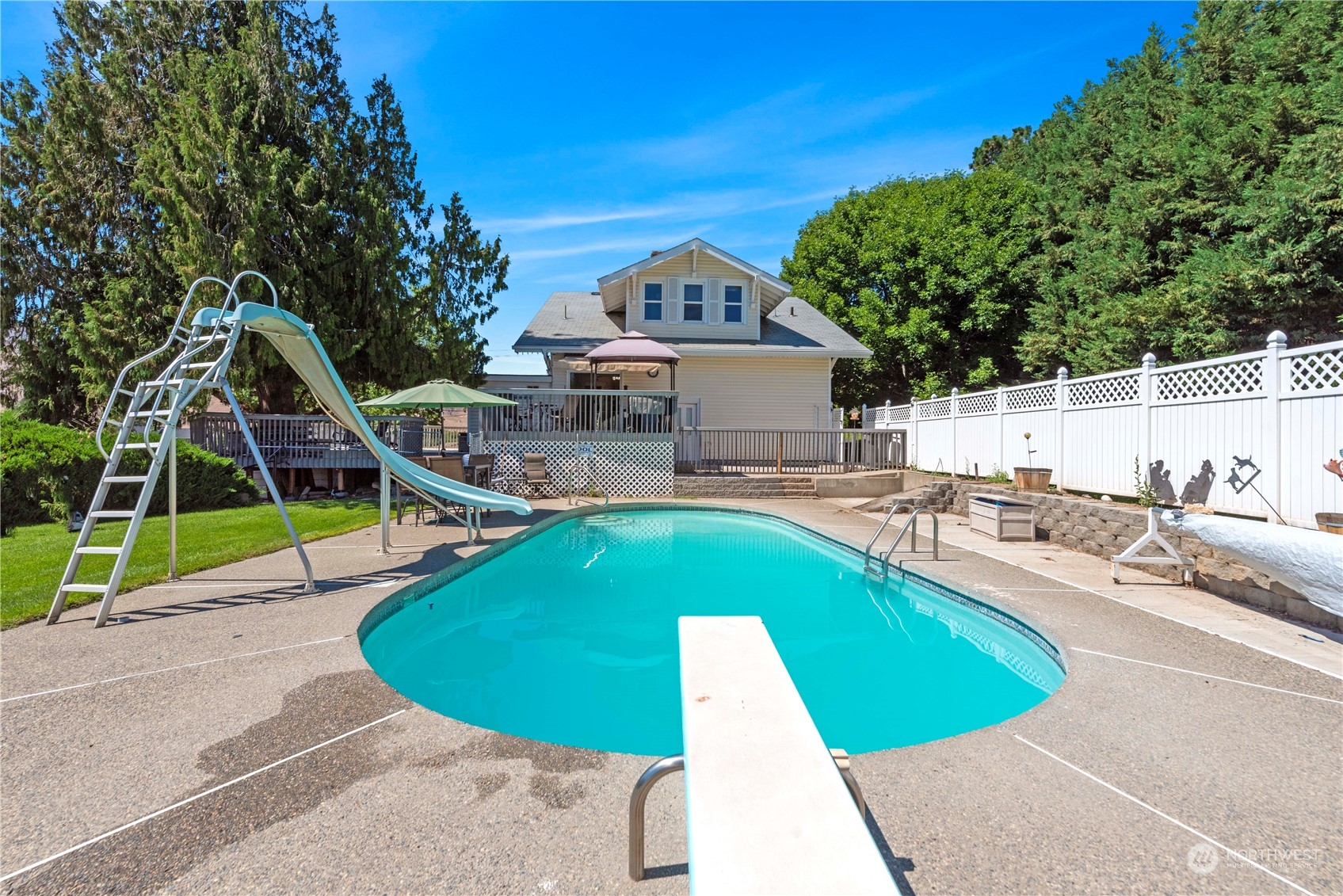 3327 Crestview Road Wenatchee, WA 98801 - Photo 35 of 39 a view of a swimming pool with a patio and a yard