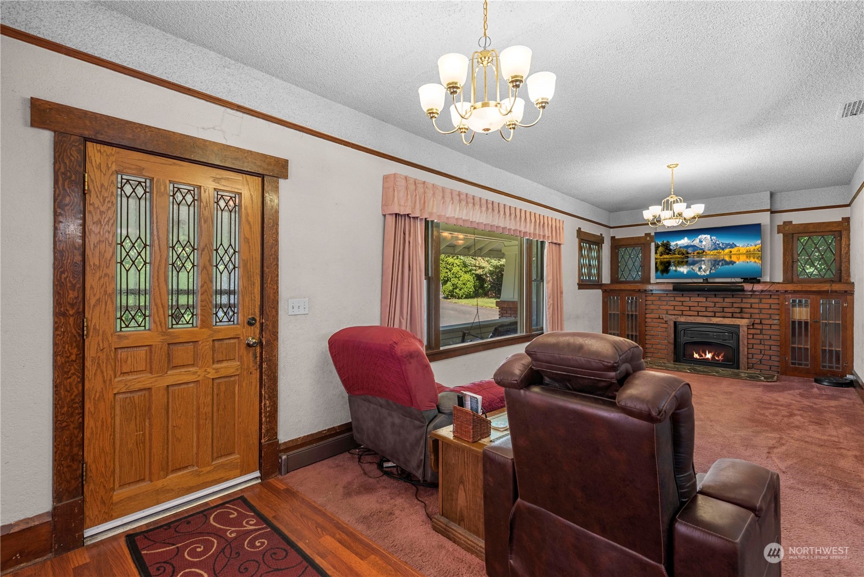 3327 Crestview Road Wenatchee, WA 98801 - Photo 7 of 39 a living room with furniture a fireplace and a window