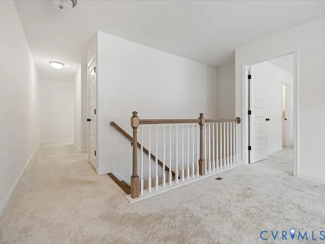 a view of a hallway with white walls