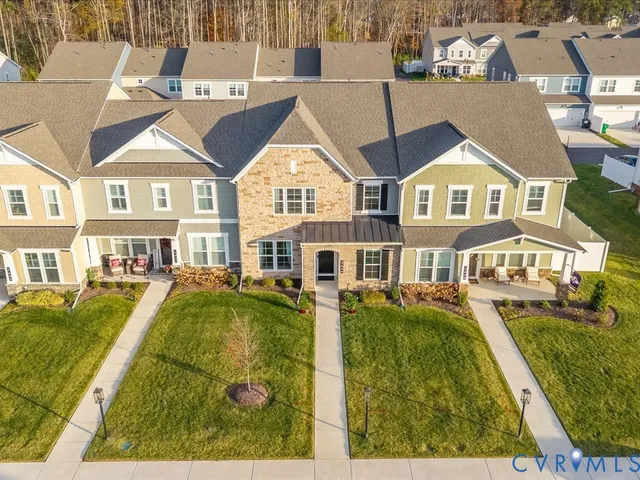 a view of a big yard and large trees