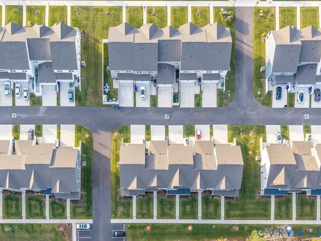 a front view of a building with a yard
