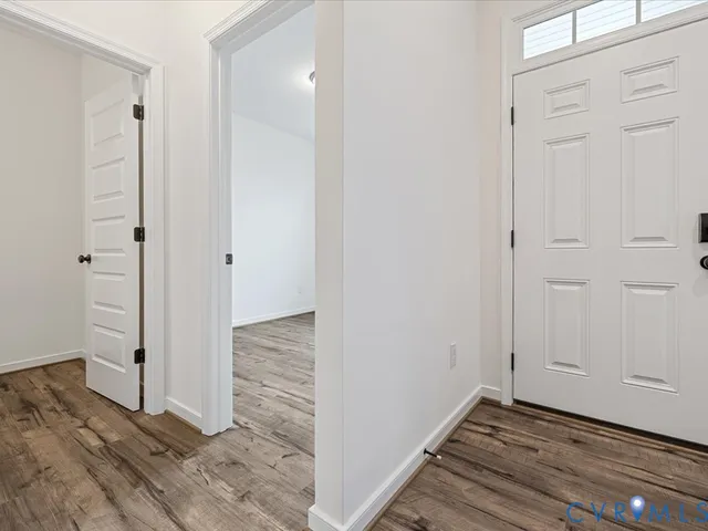 a view of a bathroom with wooden floor