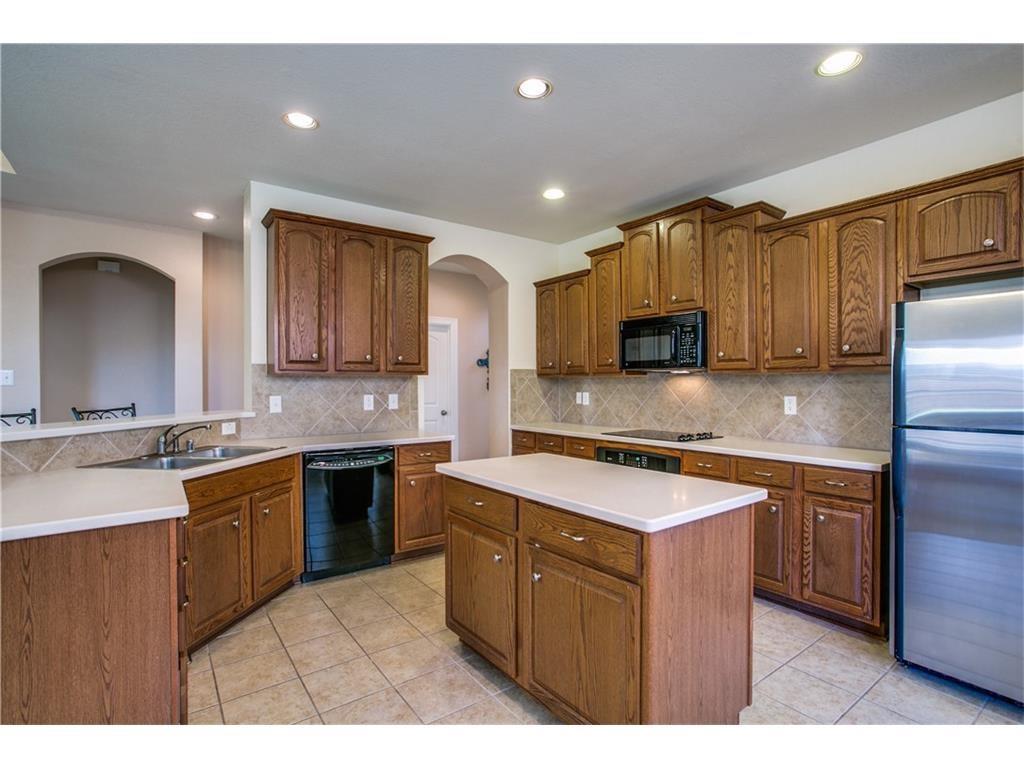 5720 Pebble Ridge Drive McKinney, TX 75070 - Photo 9 of 24 Another kitchen view. Refrigerator is not included.