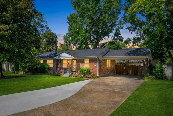a front view of house with yard and green space