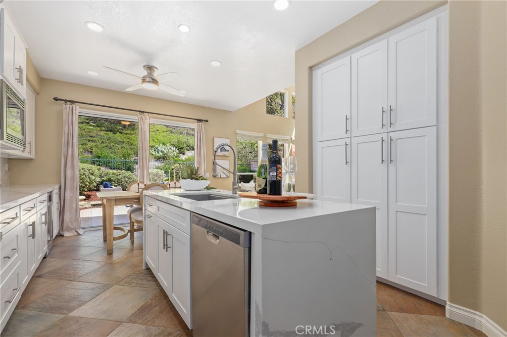 73 Blazewood Lake Forest, CA 92610 - Photo 15 of 53 a kitchen with stainless steel appliances granite countertop a sink and a stove