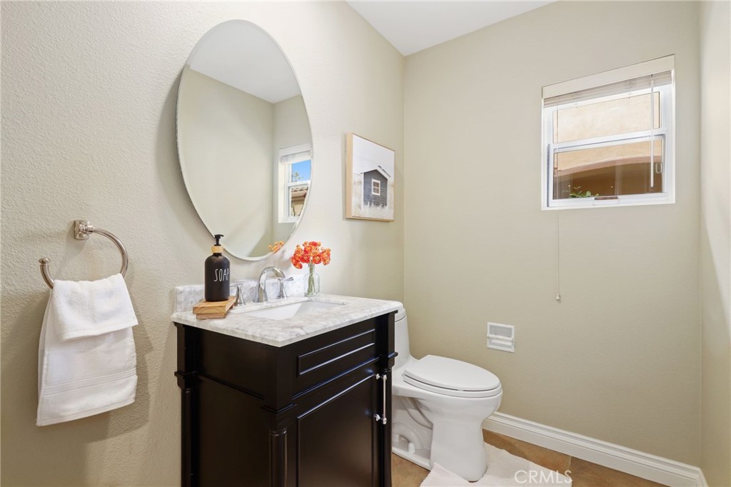 73 Blazewood Lake Forest, CA 92610 - Photo 17 of 53 a bathroom with a sink vanity mirror and toilet