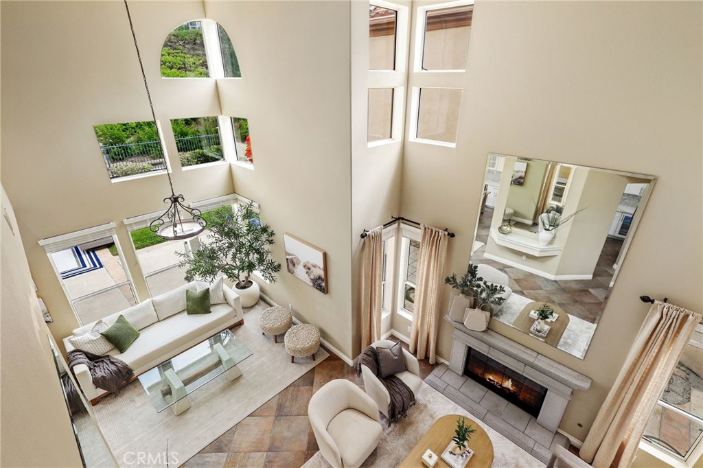 73 Blazewood Lake Forest, CA 92610 - Photo 18 of 53 a living room with furniture and a fireplace
