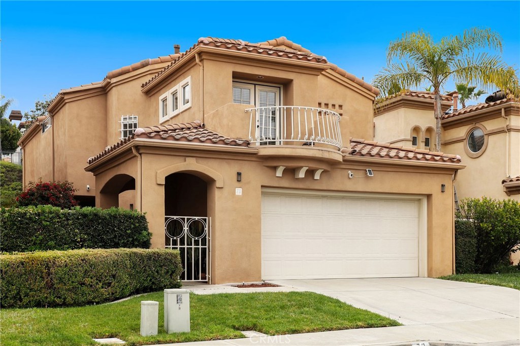 73 Blazewood Lake Forest, CA 92610 - Photo 2 of 53 a front view of a house with a yard