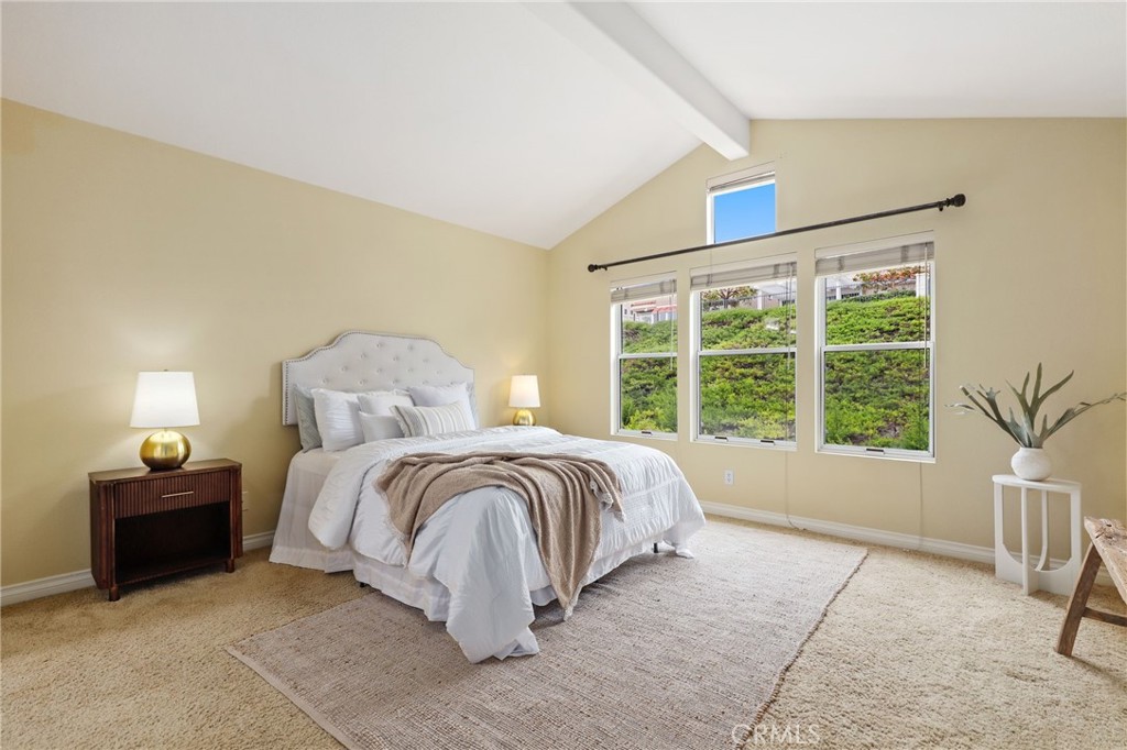 73 Blazewood Lake Forest, CA 92610 - Photo 22 of 53 a spacious bedroom with a bed and a large window