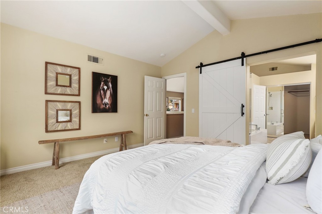 73 Blazewood Lake Forest, CA 92610 - Photo 23 of 53 a bedroom with a bed and a desk
