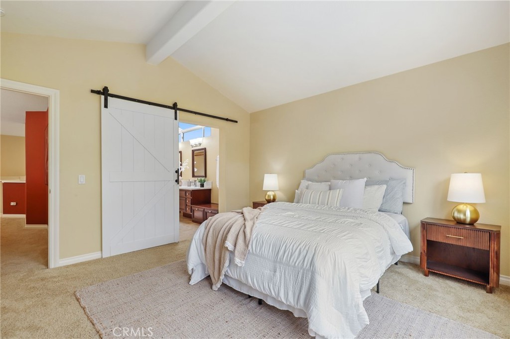 73 Blazewood Lake Forest, CA 92610 - Photo 24 of 53 a bedroom with a bed and a lamp
