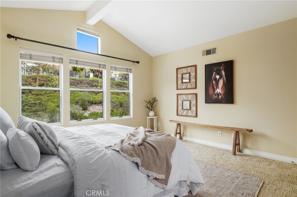 73 Blazewood Lake Forest, CA 92610 - Photo 25 of 53 a bed sitting in a bedroom next to a window
