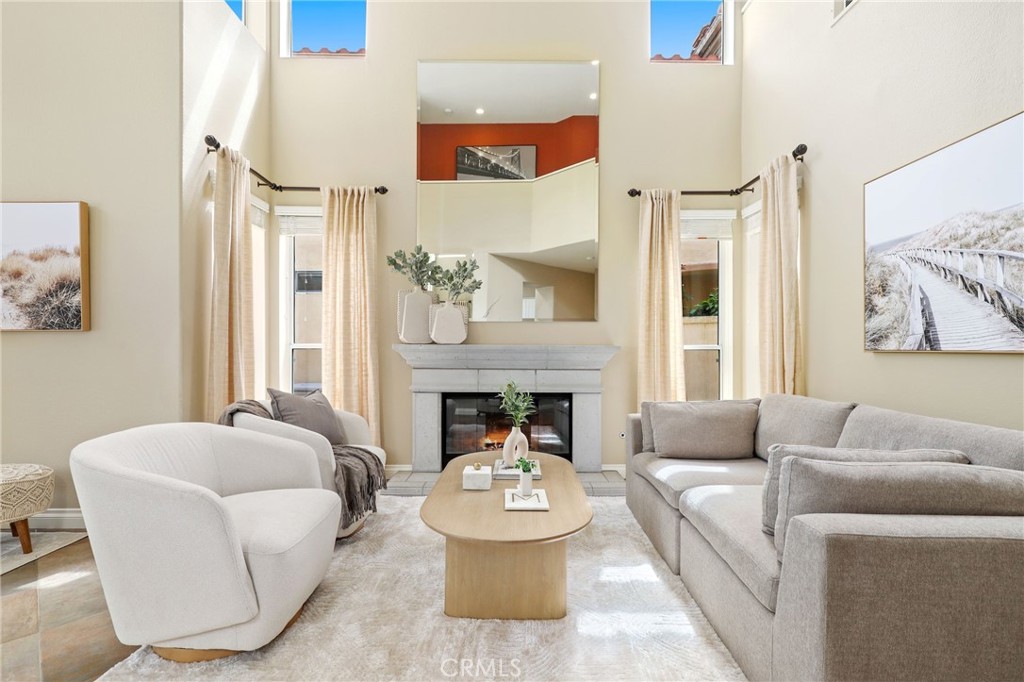 73 Blazewood Lake Forest, CA 92610 - Photo 3 of 53 a living room with furniture and a fireplace