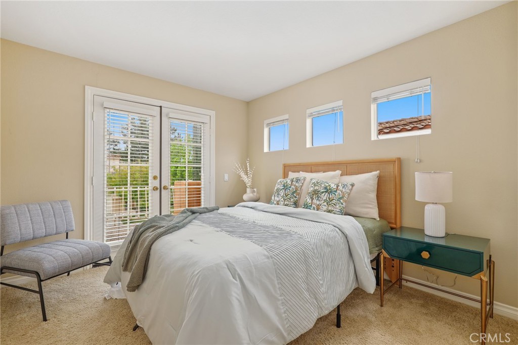 73 Blazewood Lake Forest, CA 92610 - Photo 31 of 53 a bedroom with a bed and a couch