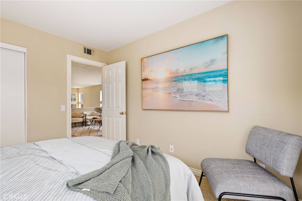 73 Blazewood Lake Forest, CA 92610 - Photo 32 of 53 a bedroom with a bed and wooden floor