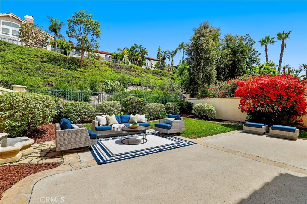 73 Blazewood Lake Forest, CA 92610 - Photo 36 of 53 a roof deck with table and chairs and potted plants
