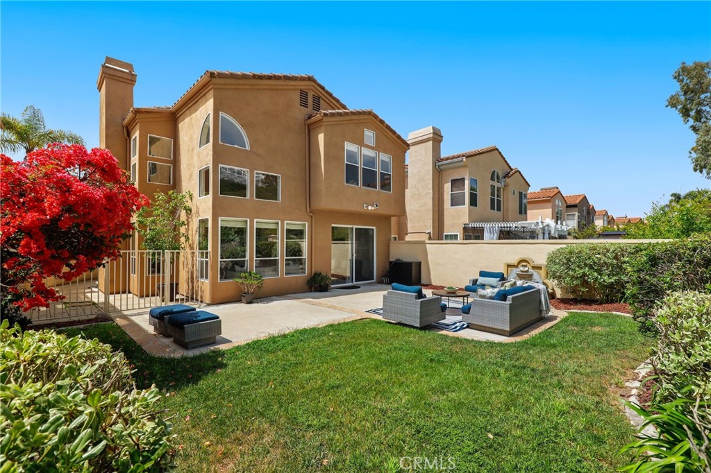 73 Blazewood Lake Forest, CA 92610 - Photo 37 of 53 a view of a house with backyard sitting area and garden