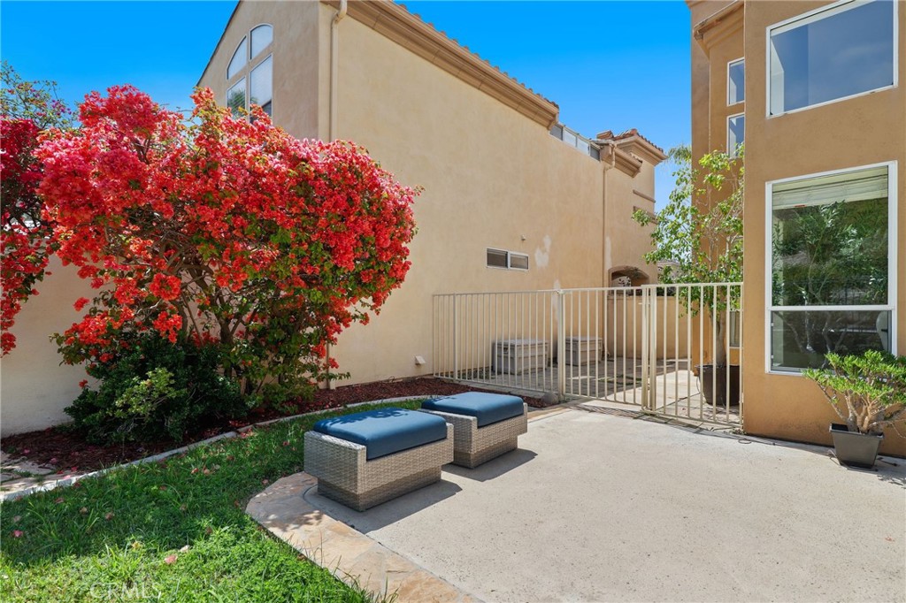 73 Blazewood Lake Forest, CA 92610 - Photo 39 of 53 a backyard of a house with table and chairs plants