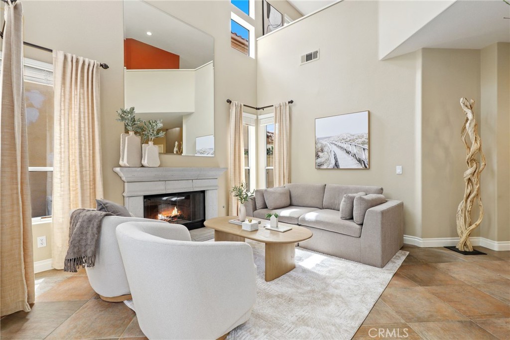 73 Blazewood Lake Forest, CA 92610 - Photo 4 of 53 a living room with furniture and a fireplace