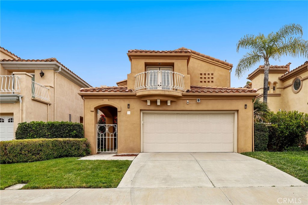 73 Blazewood Lake Forest, CA 92610 - Photo 42 of 53 a front view of a house with a garden and plants