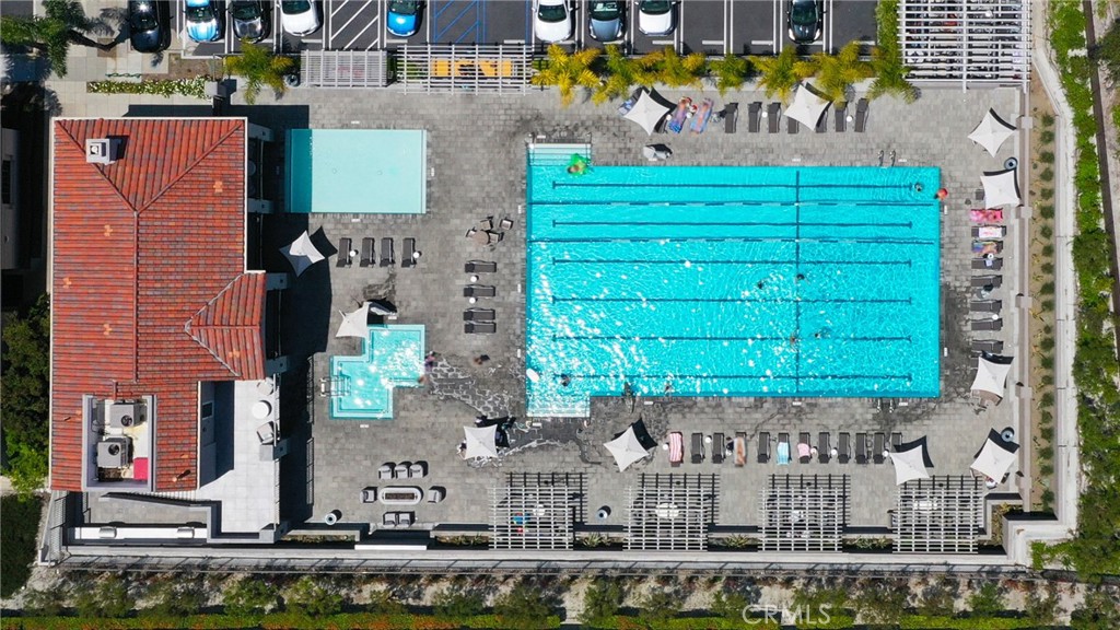 73 Blazewood Lake Forest, CA 92610 - Photo 50 of 53 a front view of a building with a yard and garage
