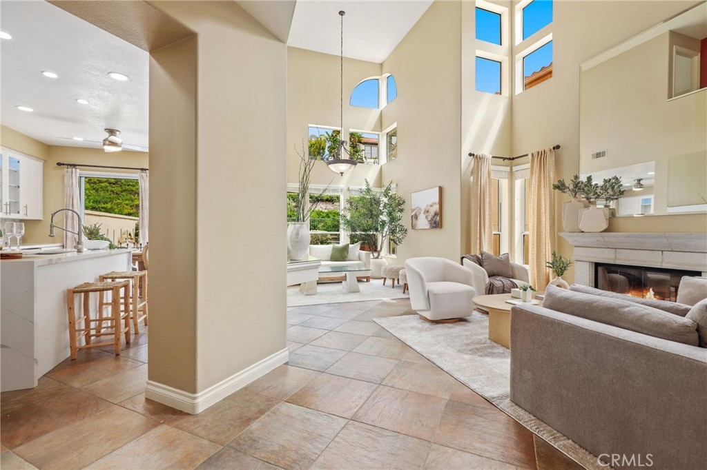 73 Blazewood Lake Forest, CA 92610 - Photo 5 of 53 a living room with furniture and a fireplace