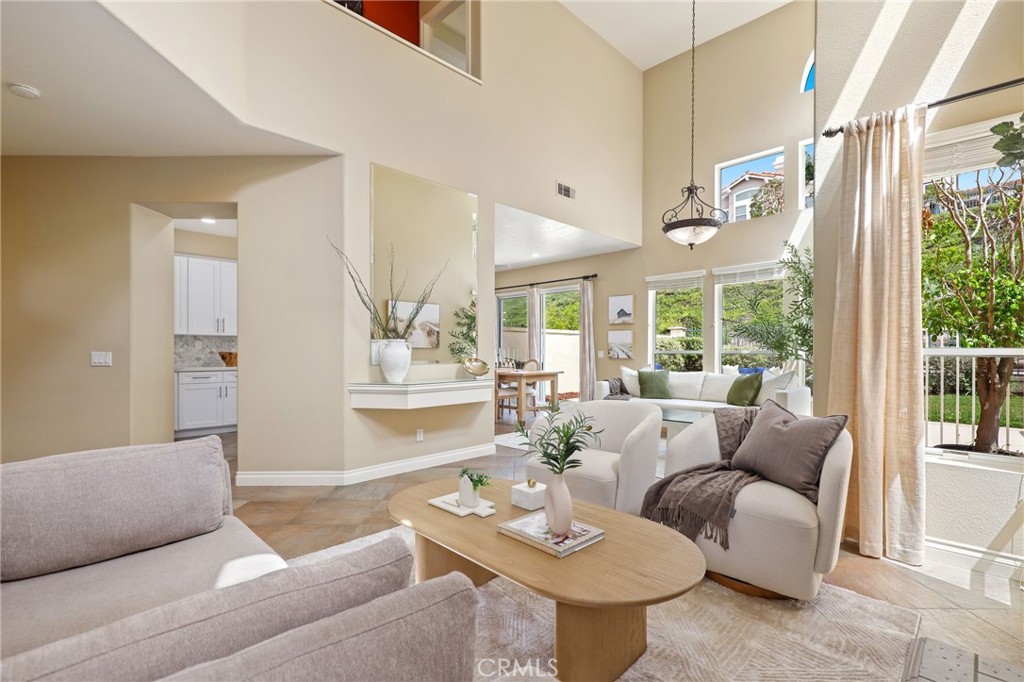 73 Blazewood Lake Forest, CA 92610 - Photo 6 of 53 a living room with furniture and a large window