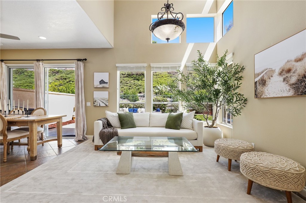 73 Blazewood Lake Forest, CA 92610 - Photo 7 of 53 a living room with furniture a rug and a large window