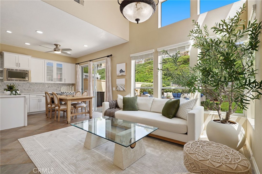 73 Blazewood Lake Forest, CA 92610 - Photo 8 of 53 a living room with furniture and a large window