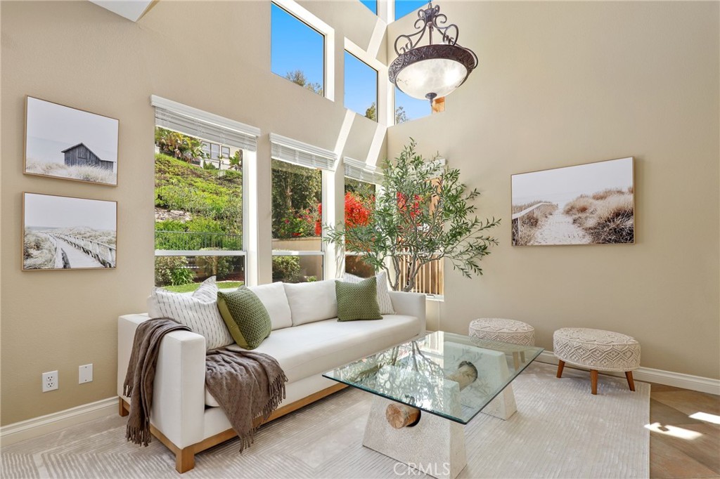 73 Blazewood Lake Forest, CA 92610 - Photo 9 of 53 a living room with furniture and a large window