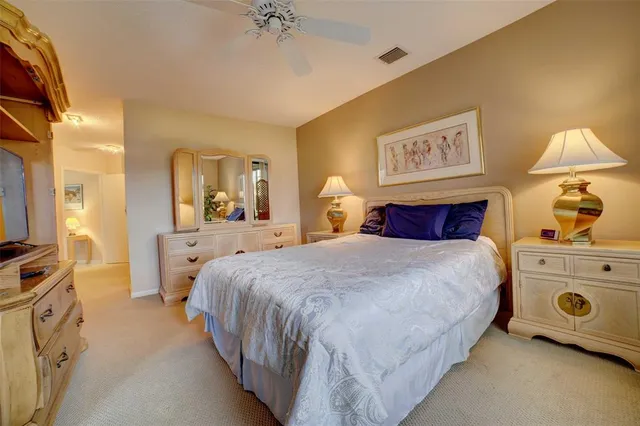 a bed room with a bed and a lamp