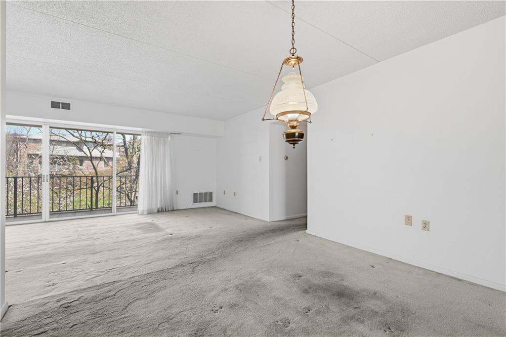 2160 Greentree Road, Unit 705W Pittsburgh, PA 15220 - Photo 9 of 32 a view of empty room with floor to ceiling window
