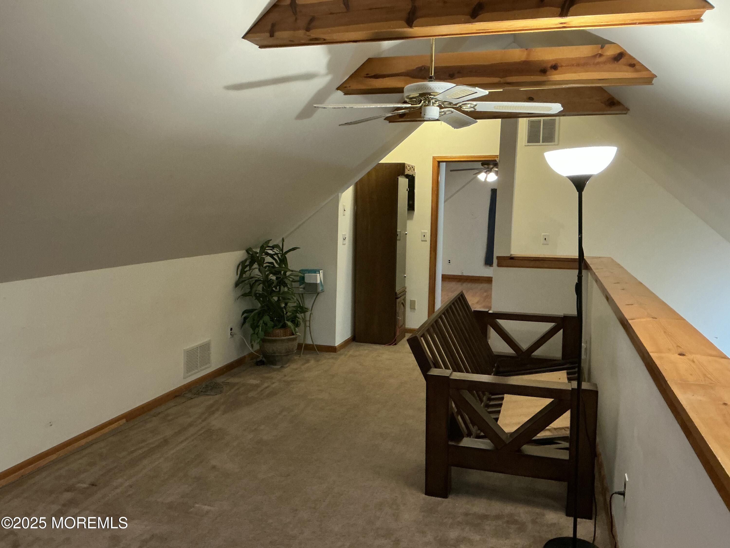 100 Solomon Street Howell, NJ 07731 - Photo 15 of 27 a view of a room with wooden floor and furniture