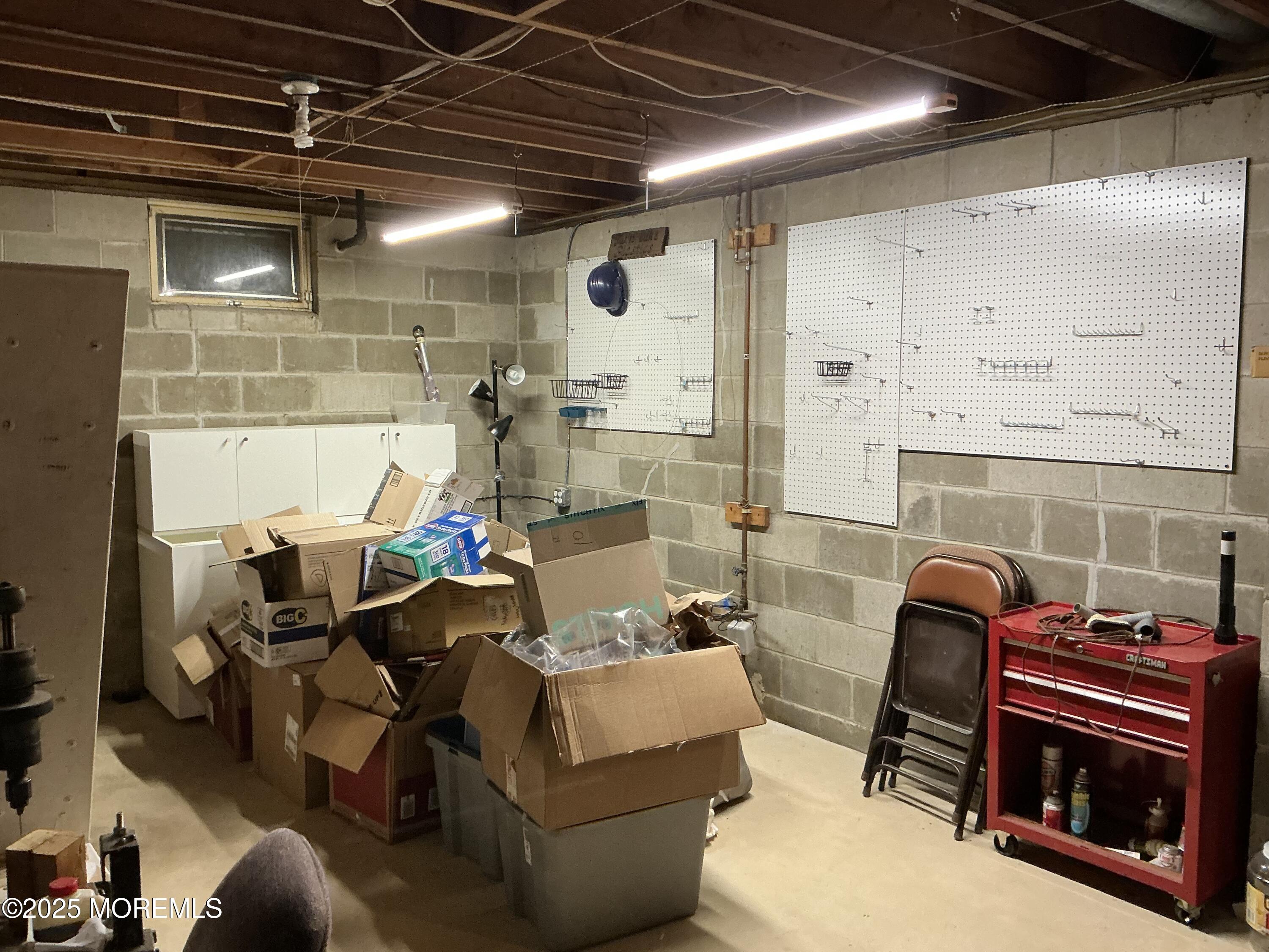 100 Solomon Street Howell, NJ 07731 - Photo 21 of 27 a living room with furniture and a fireplace