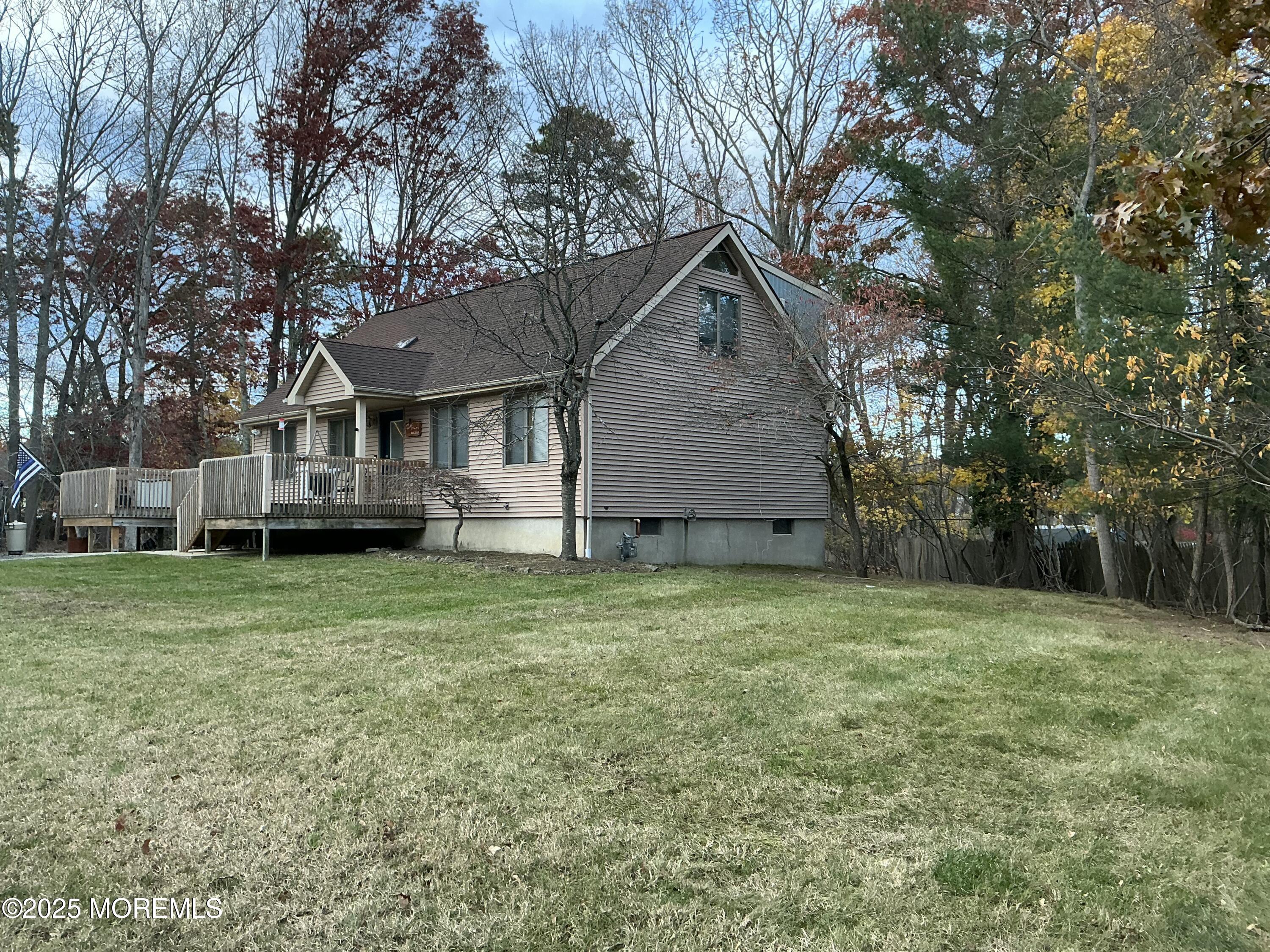 100 Solomon Street Howell, NJ 07731 - Photo 22 of 27 a house with a tree in front of the house