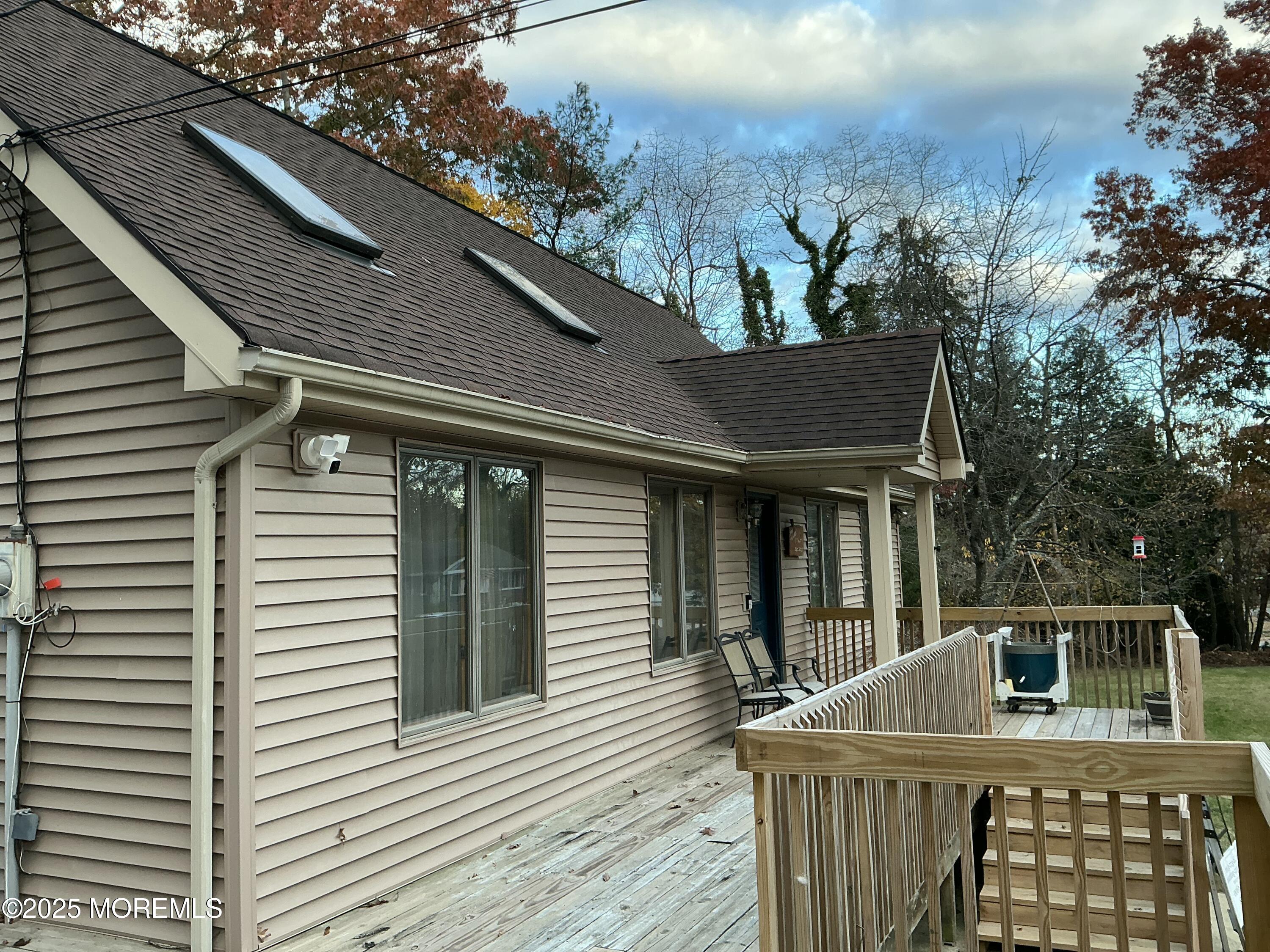 100 Solomon Street Howell, NJ 07731 - Photo 24 of 27 a view of house with deck and outdoor seating