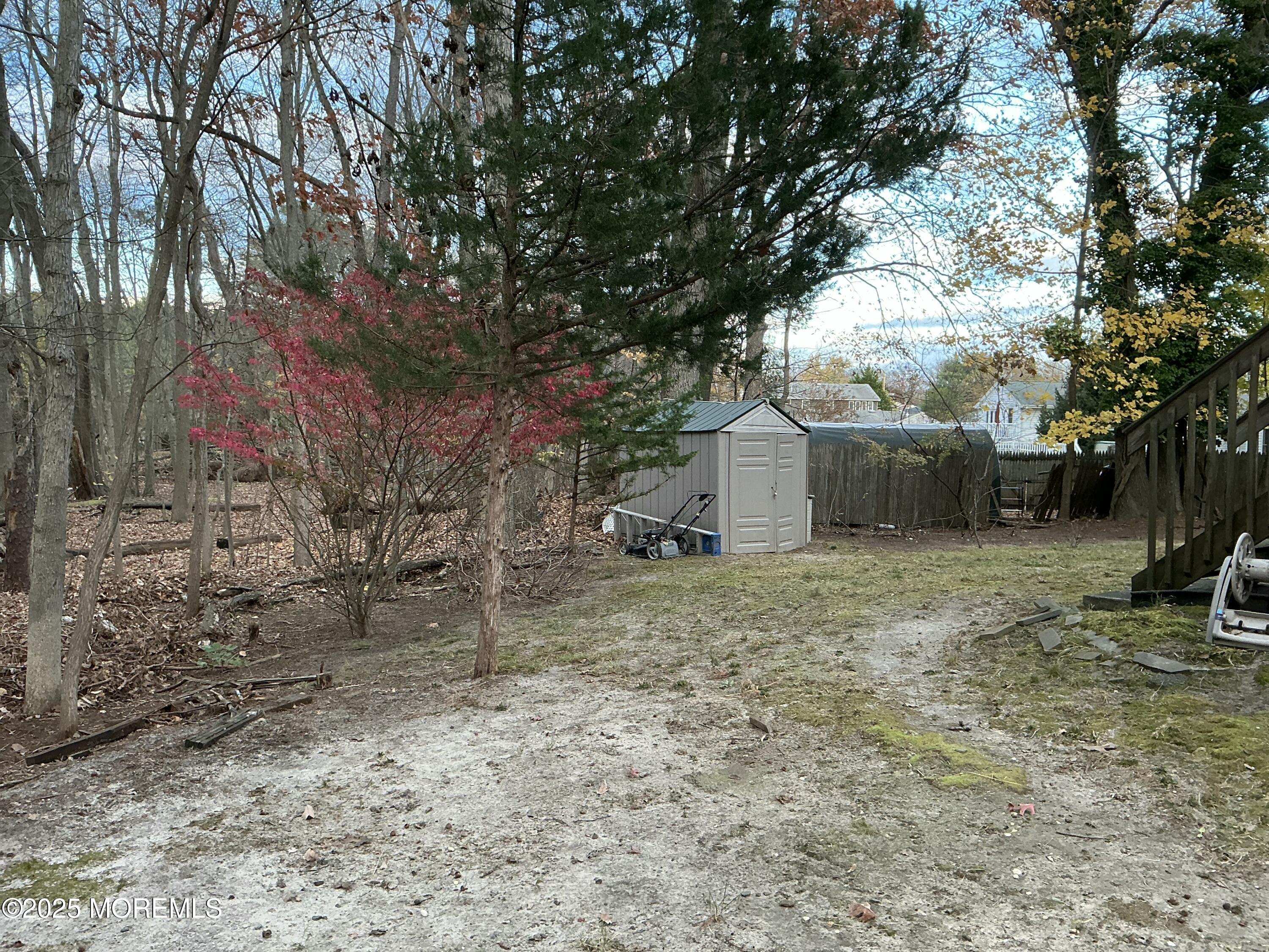 100 Solomon Street Howell, NJ 07731 - Photo 26 of 27 a backyard of a house with lots of green space