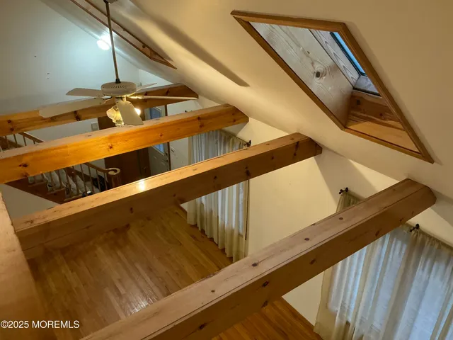 a view of balcony with wooden floor