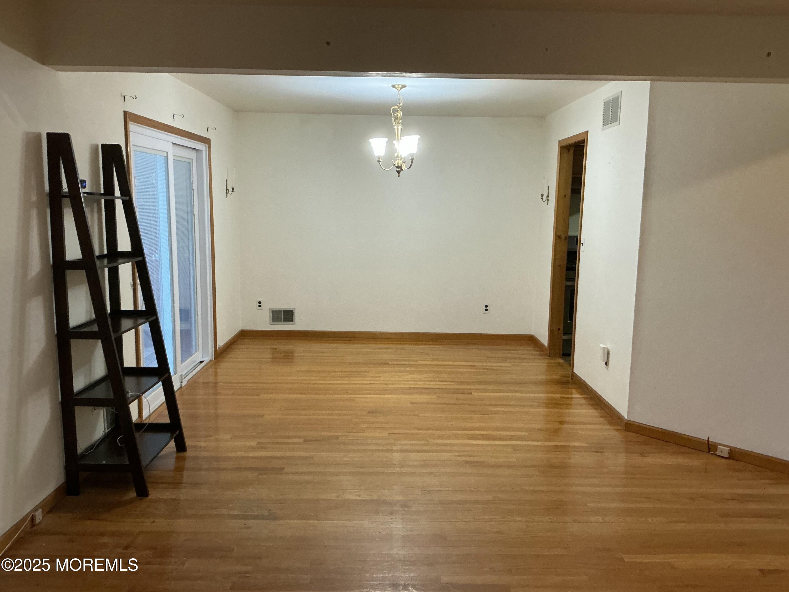 100 Solomon Street Howell, NJ 07731 - Photo 5 of 27 a view of room with walk in closet and wooden floor