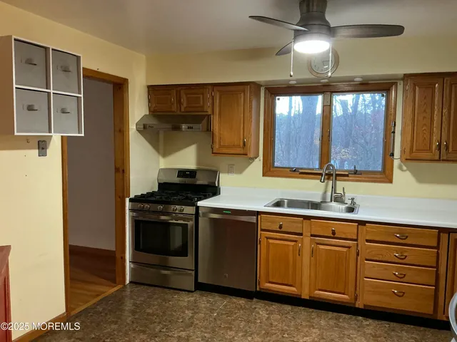 a kitchen with a stove and a sink