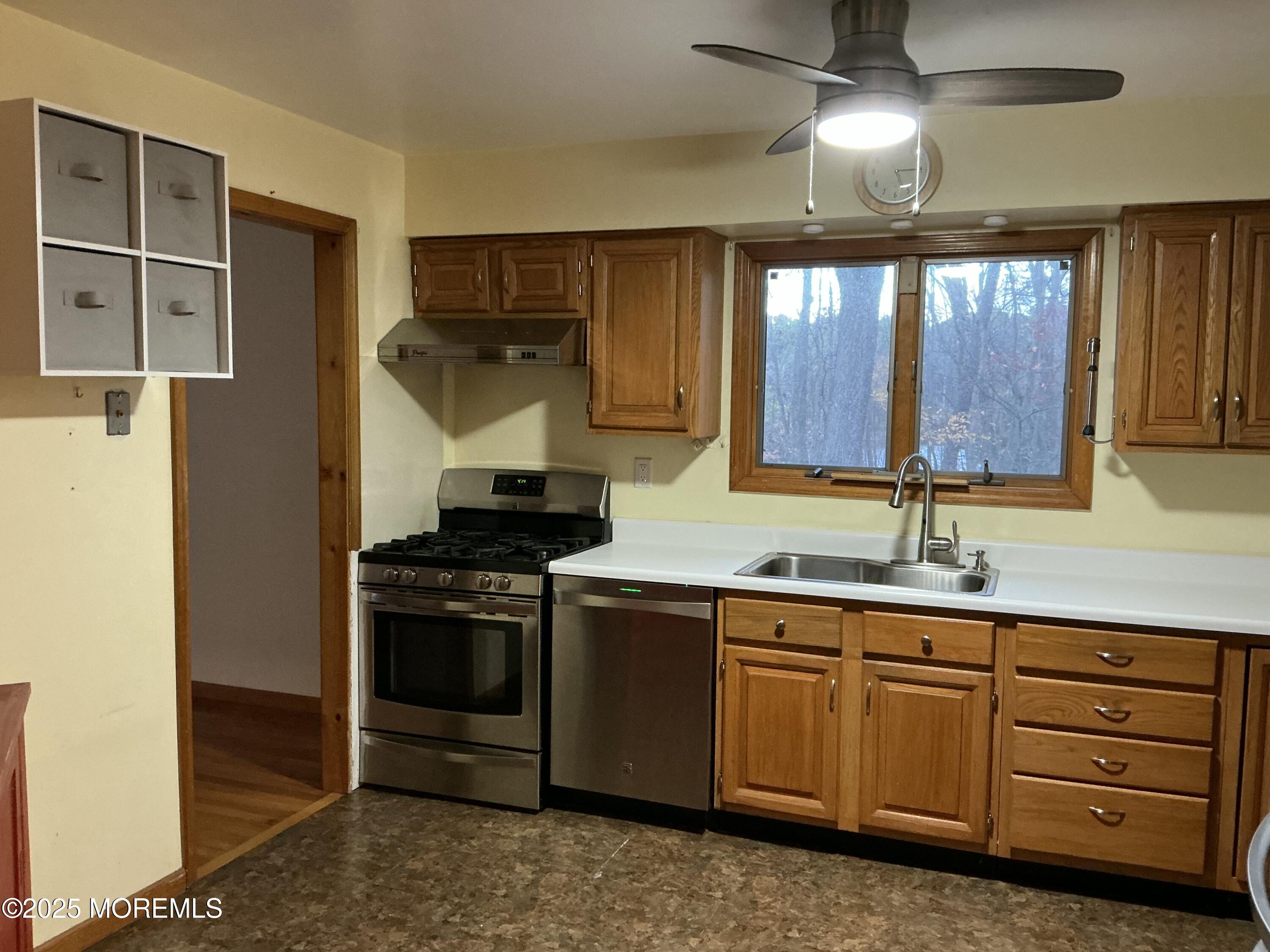 100 Solomon Street Howell, NJ 07731 - Photo 7 of 27 a kitchen with a stove and a sink