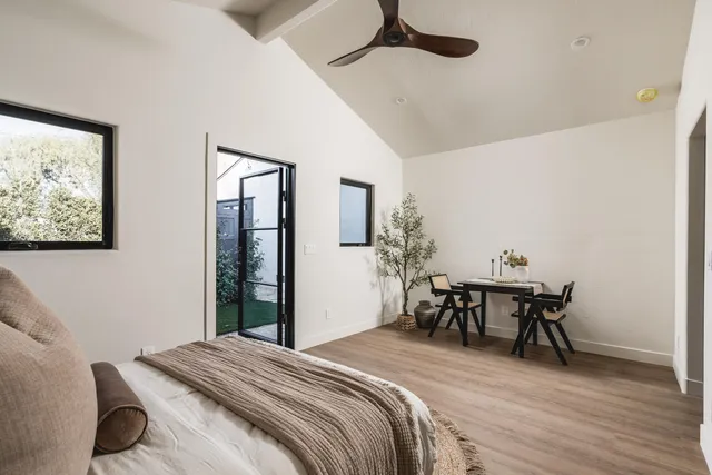 a bedroom with a bed and a table in it