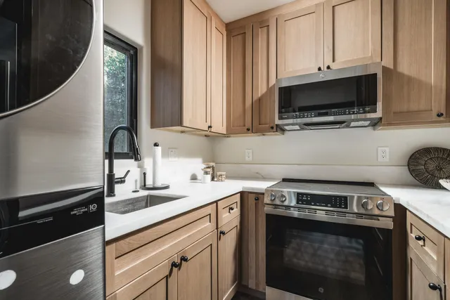 a kitchen with a stove and a microwave