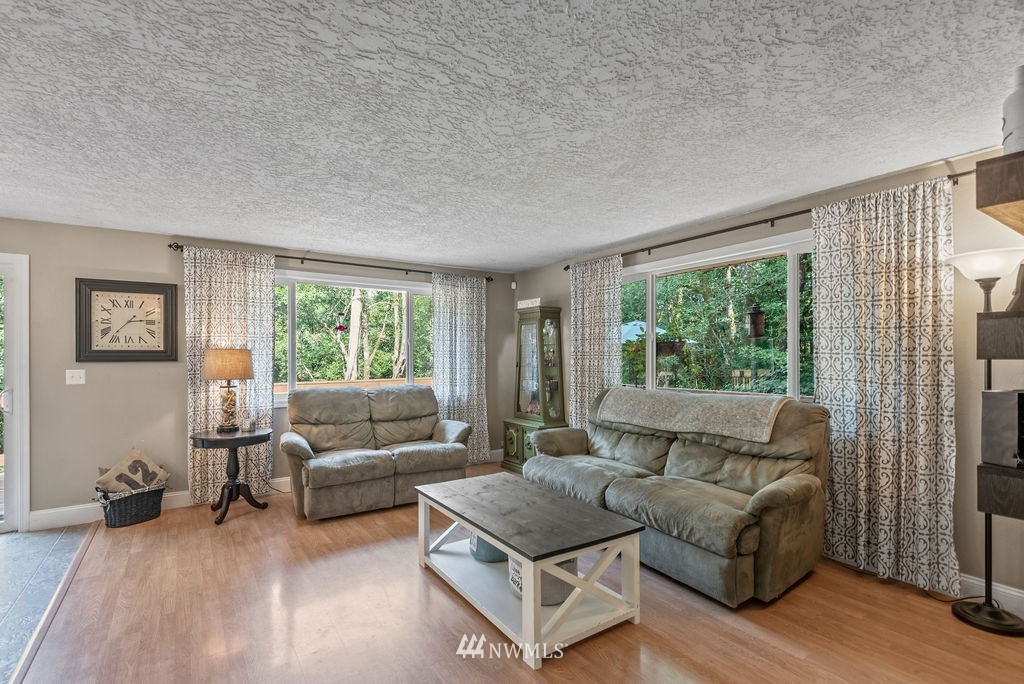 755 Hazel Dell Road Castle Rock, WA 98611 - Photo 11 of 30 a living room with furniture and a large window