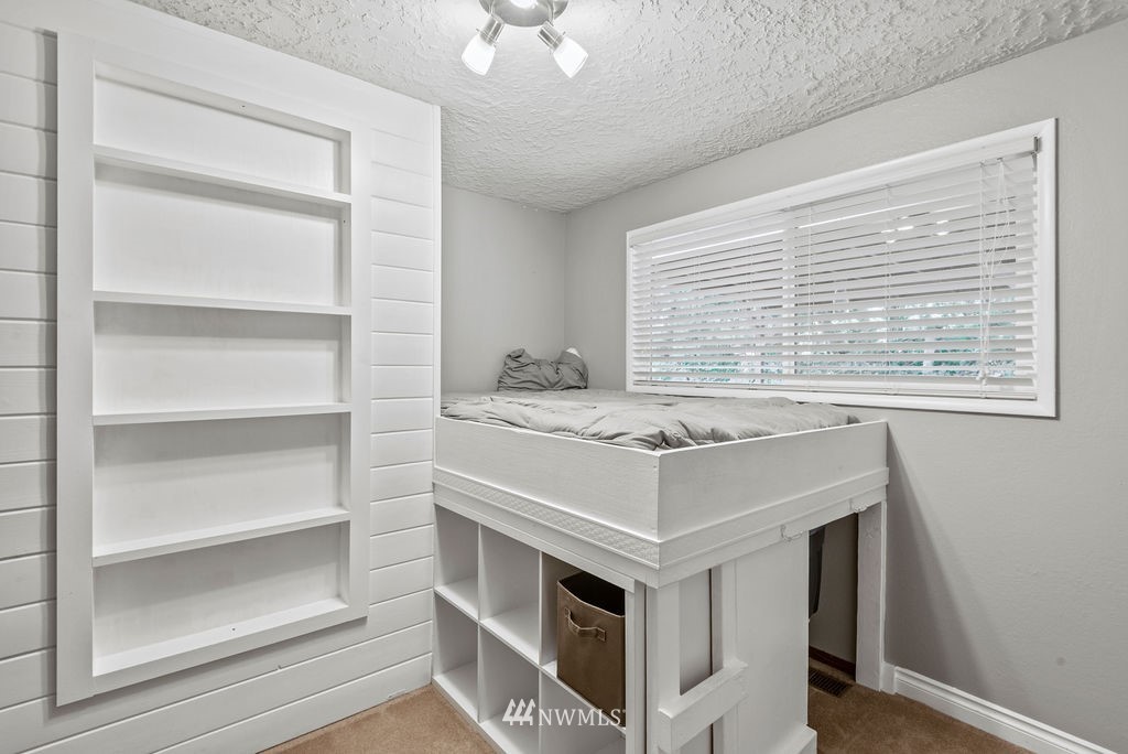 755 Hazel Dell Road Castle Rock, WA 98611 - Photo 12 of 30 a kitchen with a stove cabinets and a window