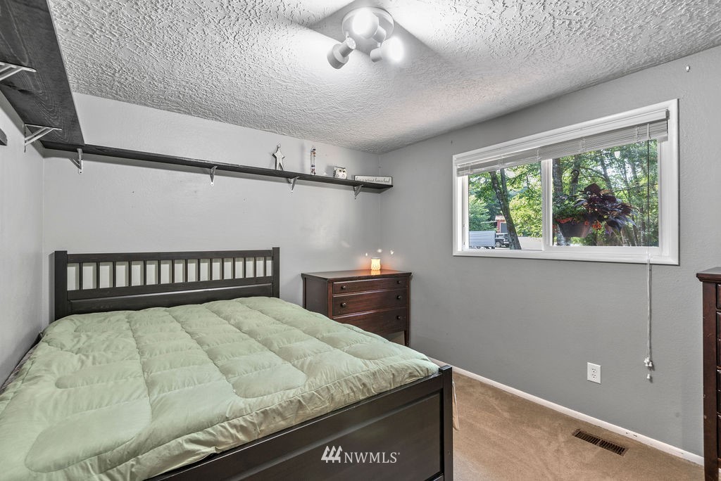 755 Hazel Dell Road Castle Rock, WA 98611 - Photo 13 of 30 a bedroom with a bed and a window