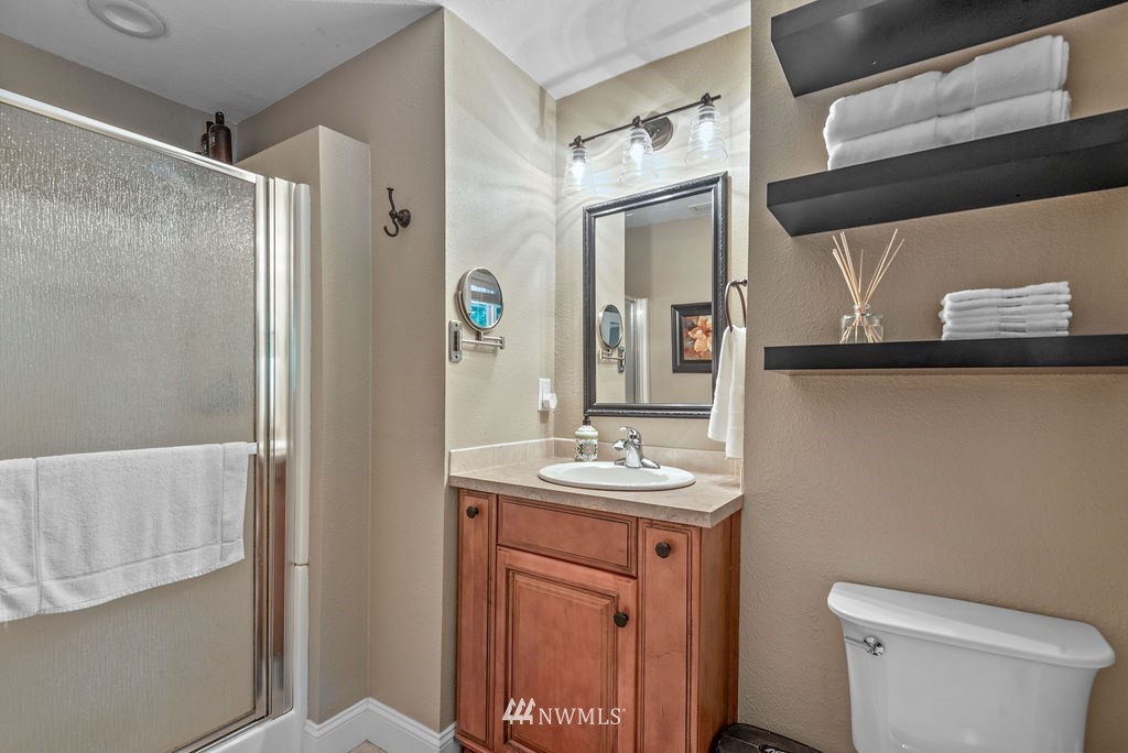 755 Hazel Dell Road Castle Rock, WA 98611 - Photo 17 of 30 a bathroom with a sink a toilet and shower
